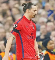  ?? — AFP photo ?? This photo taken on March 11, 2015 shows Paris Saint-Germain’s Swedish forward Zlatan Ibrahimovi­c leaving the pitch after after getting a red card during the UEFA Champions League Round of 16 second leg football match between Chelsea and Paris...