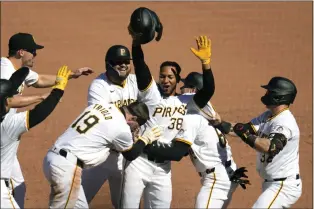  ?? GENE J. PUSKAR — THE ASSOCIATED PRESS ?? Pittsburgh Pirates’ Edward Olivares (38) celebrates after hitting a walk-off fielder’s choice off Baltimore Orioles relief pitcher Yennier Cano, driving in two runs during the ninth inning of a baseball game in Pittsburgh, Sunday, April 7, 2024. The Pirates won 3-2.