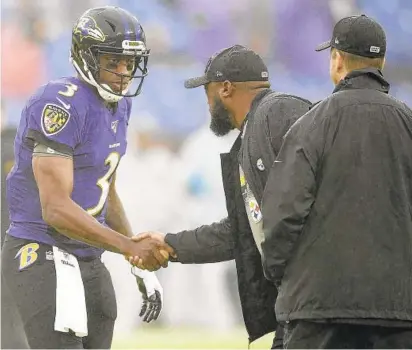  ?? NICK WASS/AP ?? Ravens QB Robert Griffin III, left, shakes hands with Steelers coach Mike Tomlin as Ravens coach John Harbaugh looks on before a game last year in Baltimore. Griffin will start Wednesday in place of Lamar Jackson, who tested positive for COVID-19 last week.