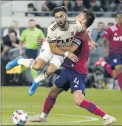  ?? MARCIO JOSE SANCHEZ – THE ASSOCIATED PRESS ?? LAFC forward Diego Rossi, left, collides with Dallas FC defender Bressan during their June 23 match.