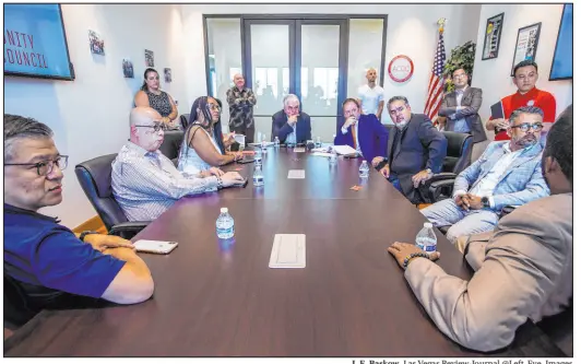  ?? L.E. Baskow Las Vegas Review-journal @Left_eye_images ?? Gov. Steve Sisolak, center, and state Treasurer Zach Conine, center right, take questions Monday as they provide an update on Nevada’s small business pandemic grant program, known as PETS, at the Asian Community Developmen­t Council.