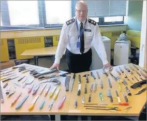  ??  ?? WEAPONS TOTAL: Colin Wingrove and the knives dumped at Uxbridge Police Station since a special bin was installed there