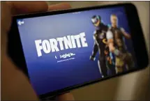  ?? ANDREW HARRER — BLOOMBERG NEWS ?? A major bug in Fortnite gave hackers access to millions of player accounts. The game is free to play and available on multiple devices.