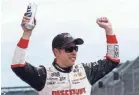  ?? MATT SULLIVAN/GETTY IMAGES ?? Brad Keselowski celebrates in victory lane after winning the Brickyard 400.