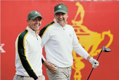  ?? Picture: JONATHAN ERNST/REUTERS ?? WHISTLING IN THE WIND: Team Europe’s Rory McIlroy and Ian Poulter on the 1st tee during a practice round ahead of the 2020 Ryder Cup in Whistling Straits, Sheboygan, Wisconsin, on Wednesday