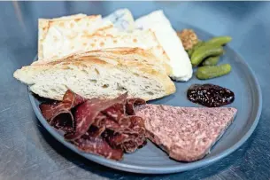  ?? ?? Cheese and meat charcuteri­e board at the Rind in Berkley on Feb. 9.