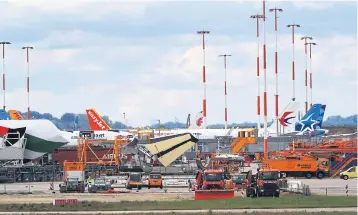  ?? BLOOMBERG ?? Tail fins of passenger aircraft stand outside the Airbus factory in Hamburg on Wednesday.