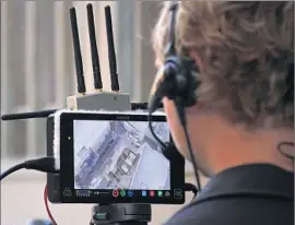  ?? Myung J. Chun ?? AUSTIN HARRIS, a camera operator for Aerial MOB, watches a monitor during shooting of a scene for “Criminal Minds: Beyond Borders” in Santa Clarita.