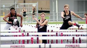  ??  ?? Blackhawks Kenny Dorsey and Justin Koon cleared hurdles during competitio­n Thursday in the Pioneer Relays. Koon came in third with a time of 17.64 and Dorsey came in fourth with a time of 18.17.