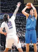  ??  ?? Mavericks forward Dirk Nowitzki has a bone bruise on his right knee.