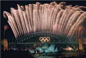  ?? Photograph: Steve Holland/AP ?? Celebratio­ns at the end of the 2000 Summer Games in Sydney. John Coates acknowledg­ed making offers to two African National Olympic Committees that were within the rules at the time.