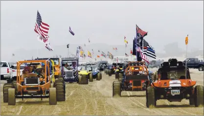  ?? DAVID MIDDLECAMP — SAN LUIS OBISPO TRIBUNE ?? Hundreds of dune buggies parade along the Oceano Dunes State Recreation­al Vehicle Area in Oceano in August 2018. The California Coastal Commission voted 10-0 on Thursday to phase out off-road vehicle use at Oceano Dunes within three years.