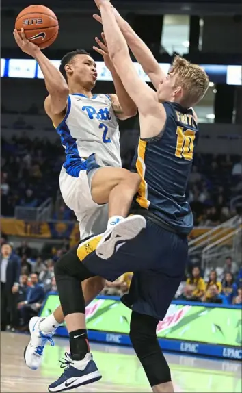  ?? Alexandra Wimley/Post-Gazette ?? Trey McGowens drives to the basket Monday against Canisius guard Jacco Fritz in Pitt’s final non-conference game. ACC play begins in earnest Saturday against Wake Forest.