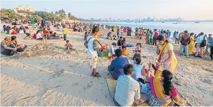  ??  ?? SANDS OF TIME: Girgaum Chowpatty public beach in Mumbai, above, and the pool at the Taj Mahal Palace hotel, right