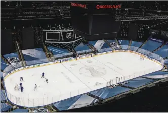  ?? The Canadian Press ?? The Vancouver Canucks skate Friday at Rogers Place in Edmonton. The Canucks and Vegas Golden Knights will resume their NHL playoff series on Saturday.