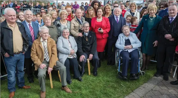  ??  ?? The extended Savage family are introduced to President Michael D Higgins and Sinn Féin President Mary Lou McDonald in Ballisodar­e last Friday. Pic: Donal Hackett.