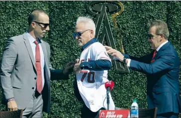  ?? Gary Coronado Los Angeles Times ?? ANGELS GENERAL MANAGER Billy Eppler, left, and owner Arte Moreno welcomed Joe Maddon as their new manager 11 months ago. But now Moreno must f ind another GM after f iring Eppler on Sunday afternoon.