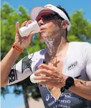  ?? Photo / Getty Images ?? Braden Currie finishes third in Ironman World Championsh­ip in St. George, Utah.