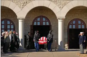  ?? on Saturday in Russell, Kan. (AP/Charlie Riedel) ?? The casket holding former Sen. Bob Dole, R-Kan., is carried to a hearse after a memorial service