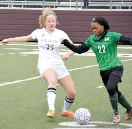  ?? Graham Thomas/Herald-Leader ?? Siloam Springs junior midfielder Megan Hutto, left, battles Muskogee (Okla.) forward Dia Brown for the ball during Monday’s game at Panther Stadium. The Lady Panthers defeated the Lady Roughers 3-0.