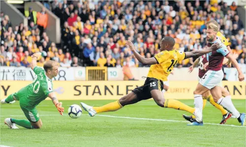  ?? Nathan Stirk ?? Willy Boly has a shot saved by Joe Hart during the weekend’s clash at Molineux