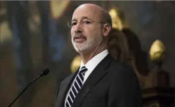  ?? Matt Rourke/Associated Press ?? Democratic Gov. Tom Wolf delivers his budget address for the 2019-20 fiscal year on Tuesday to a joint session of the Pennsylvan­ia House and Senate in Harrisburg.