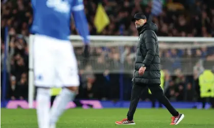  ?? AMA/Getty Images ?? Jürgen Klopp walks off after Liverpool lose to Everton. ‘The game was just horrible to watch,’ he said. Photograph: Robbie Jay Barratt/