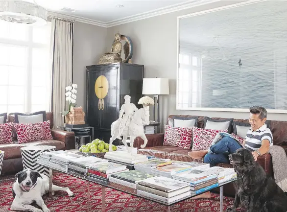  ?? PHOTOS: DAVID A. LAND/VERN YIP ?? Interior designer Vern Yip relaxes at home with his dogs. The home decor industry has “come to realize that this is a way of life for a lot of people,” Yip says.