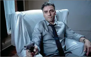  ?? COURTESY OF FOCUS FEATURES/TNS ?? “The Card Counter” stars Oscar Isaac as a card shark traveling from casino to casino while trying to outrun his memories of war crimes committed in Abu Ghraib.