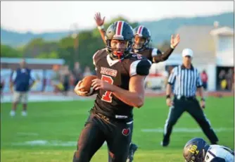  ?? THOMAS NASH - DIGITAL FIRST MEDIA ?? Boyertown’s Jamie Moccia (7) hits the end zone for a touchdown as teammate Dylan Robertson signals for the score against Upper Perkiomen Friday.