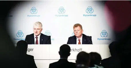  ??  ?? Heinrich Hiesinger, chairman of ThyssenKru­pp (left) and CFO Guido Kerkhoff attend a press conference to announce a merger of European operations with Tata. (AFP)