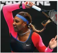  ?? (AP/Rick Rycroft) ?? American Serena Williams returns a forehand to German Laura Siegemund during her first-round victory Monday at the Australian Open.