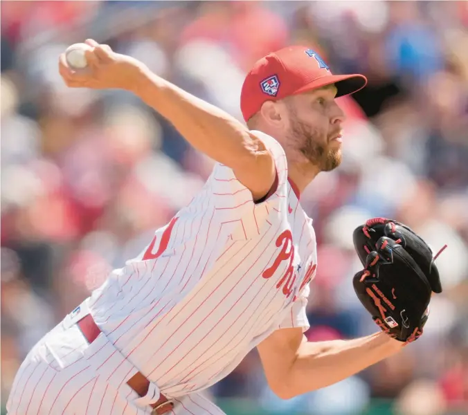  ?? CHARLIE NEIBERGALL/AP ?? Phillies starting pitcher Zack Wheeler throws during the third inning of a spring training game against the Yankees on March 11 in Clearwater, Florida.