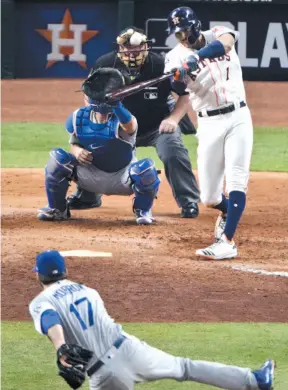  ?? AP PHOTO ?? Carlos Correa of the Houston Astros belts a two-run home run off Los Angeles Dodgers relief pitcher Brandon Morrow during the seventh inning of Game 5 of the World Series on Sunday night in Houston.