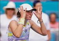  ?? Wilfredo Lee / Associated Press ?? Iga Swiatek reacts after beating Naomi Osaka to win the Miami Open on Saturday.