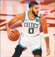  ?? Mike Ehrmann / Getty Images ?? The Celtics’ Jayson Tatum handles the ball during the third quarter against the Grizzlies on Tuesday.