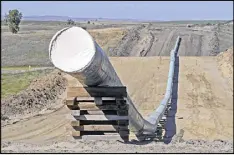  ?? TOM STROMME / BISMARCK TRIBUNE 2016 ?? The 1,200-mile Dakota Access Pipeline, under constructi­on (above) near St. Anthony, N.D., was designed to carry North Dakota oil through the Dakotas and Iowa to a shipping point in Illinois.