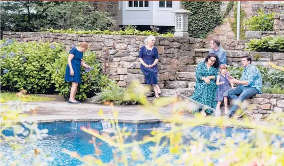  ?? TOM SIBLEY/THE NEW YORK TIMES ?? Ellen Scherer Crafts and Trevor Crafts with their daughter Riley, 5, and her grandparen­ts Jackie Chirico, center, and Edward and Heather Crafts, outside the home they all bought together in Weston, Connecticu­t.