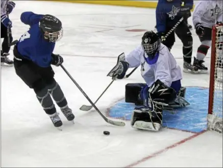  ?? RANDY MEYERS — THE MORNING JOURNAL ?? Goalie Brooks Montgomery of CVCA blocks a shot by Sumner Mead of Rocky River during the GCHSHL All Star Tournament.