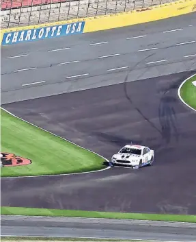  ??  ?? Kurt Busch drives through a chicane during a test of the roval course at Charlotte Motor Speedway in Concord, North Carolina, last year.