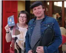  ??  ?? Librarian Ger Dunne with Eoin ‘Stan’ O’Sullivan at a recent mini-concert in Newmarket Library.