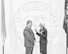  ?? — Reuters photo ?? Managing director of the Internatio­nal Monetary Fund (IMF) Christine Lagarde (right) talks to Ukrainian president Petro Poroshenko during their meeting at the IMF headquarte­rs in Washington in 2017.
