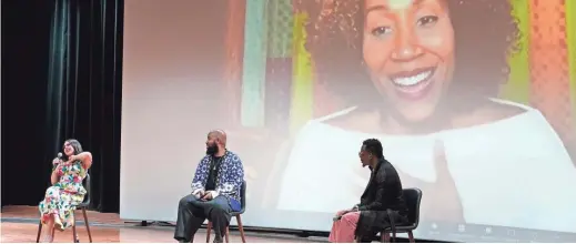  ?? MARK HUMPHREY/AP ?? Valerie Ponzio, from left, Claude Kelly, and Chuck Harmony take part in a discussion moderated by Rissi Palmer, on screen, during the Rosedale Summit at the National Museum of African American Music on Nov. 8 in Nashville. The Rosedale Summit brought artists, academics and historians together to address racial representa­tion within the genre of country music.