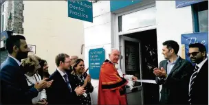  ??  ?? GRAND OPENING: The ribbon is officially cut at the new practice on Harefield High Street