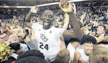  ?? STEPHEN M. DOWELL/ORLANDO SENTINEL ?? Attraction­s such as 7-foot-6 Tacko Fall have boosted UCF’s image beyond its humble Central Florida origins.