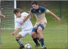  ?? GENE WALSH — DIGITAL FIRST MEDIA ?? La Salle’s Chris Metzler controls the ball as Lansdale Catholic’s Evan Senour defends Friday.