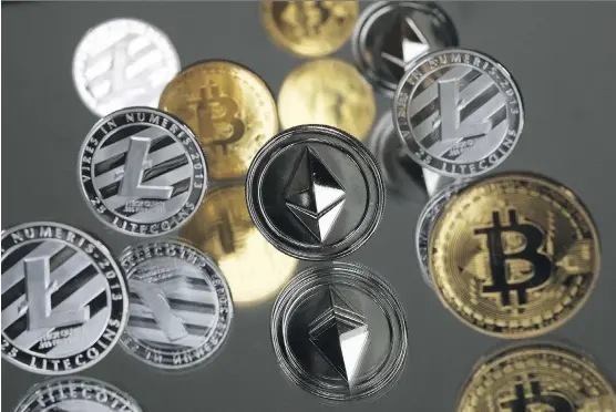  ?? CHRIS RATCLIFFE/ BLOOMBERG ?? A collection of bitcoin, litecoin and ethereum tokens. A flurry of recent blockchain announceme­nts by companies big and small has sent stock prices surging.