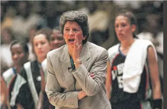  ?? KEVORK DJANSEZIAN/ AP ?? New York Liberty coach Nancy Darsch calls out instructio­ns to her players during the inaugural WNBA basketball game, on June 21, 1997, against the Los Angeles Sparks in Inglewood, California. The Liberty defeated the Sparks, 67- 57.