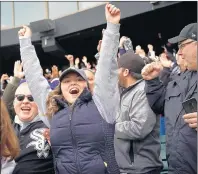  ?? E. JASONWAMBS­GANS/CHICAGO TRIBUNE ?? Brittany Emerson, of Valparaiso, Ind., cheers Yoan Mocada’s double that drove in two runs in the first inning of Friday’s 2019 home opener against the Seattle Mariners at Guaranteed Rate Field.