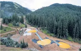  ?? BRENNAN LINSLEY/AP 2015 ?? Wastewater flows through retention ponds built to contain and filter out heavy metals and chemicals from the Gold King Mine in Silverton, Colorado.